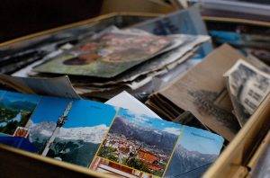 unpacked box with home photos inside